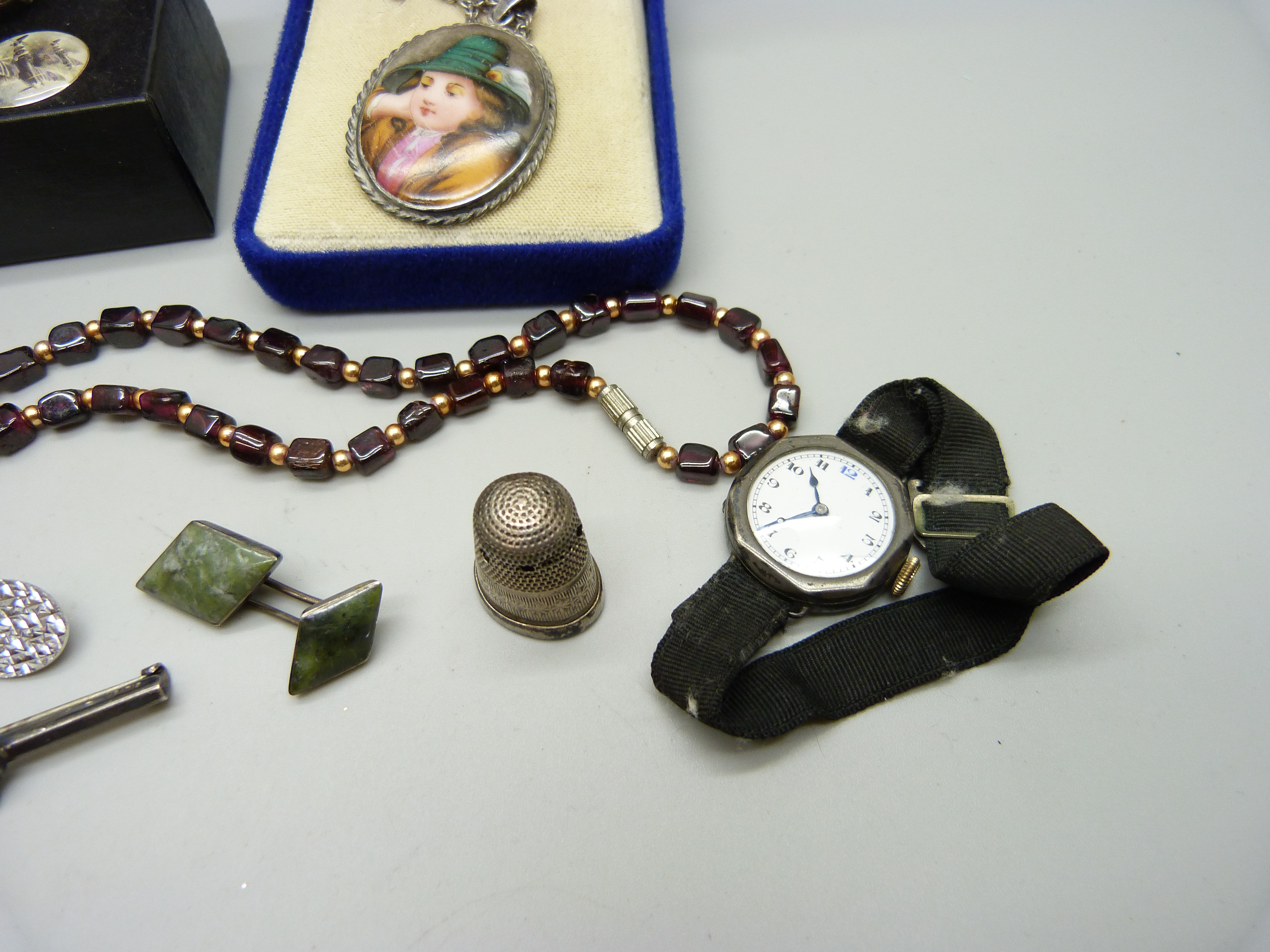 A garnet necklace, a pair of silver cufflinks, a silver cased wristwatch, a silver fox bar brooch, - Image 3 of 4
