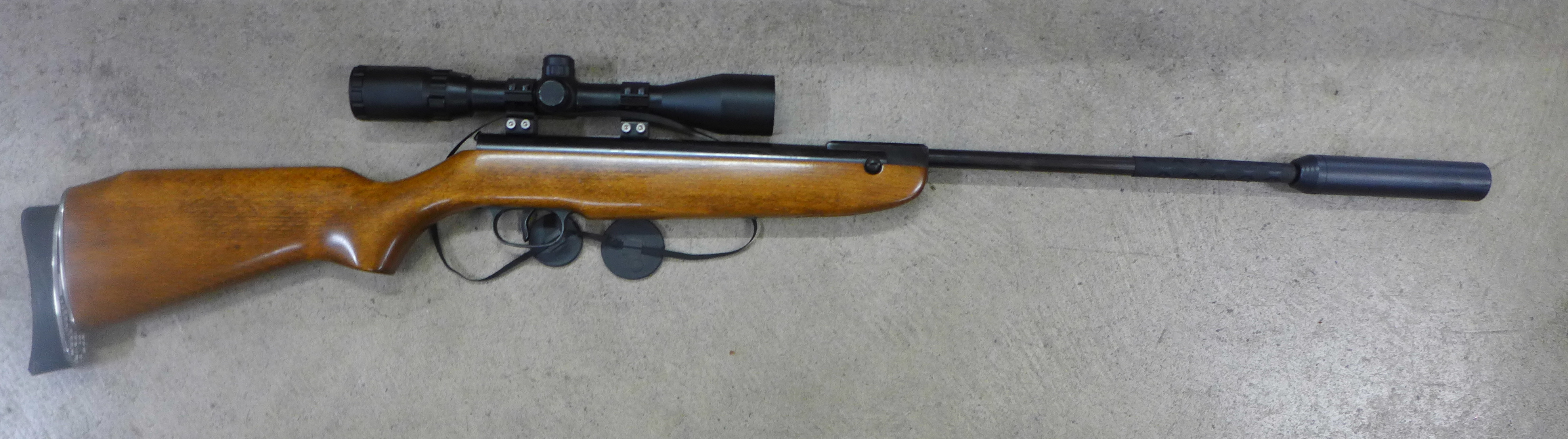 A Weihrauch HW 30 .177 calibre air rifle, with scope and silencer