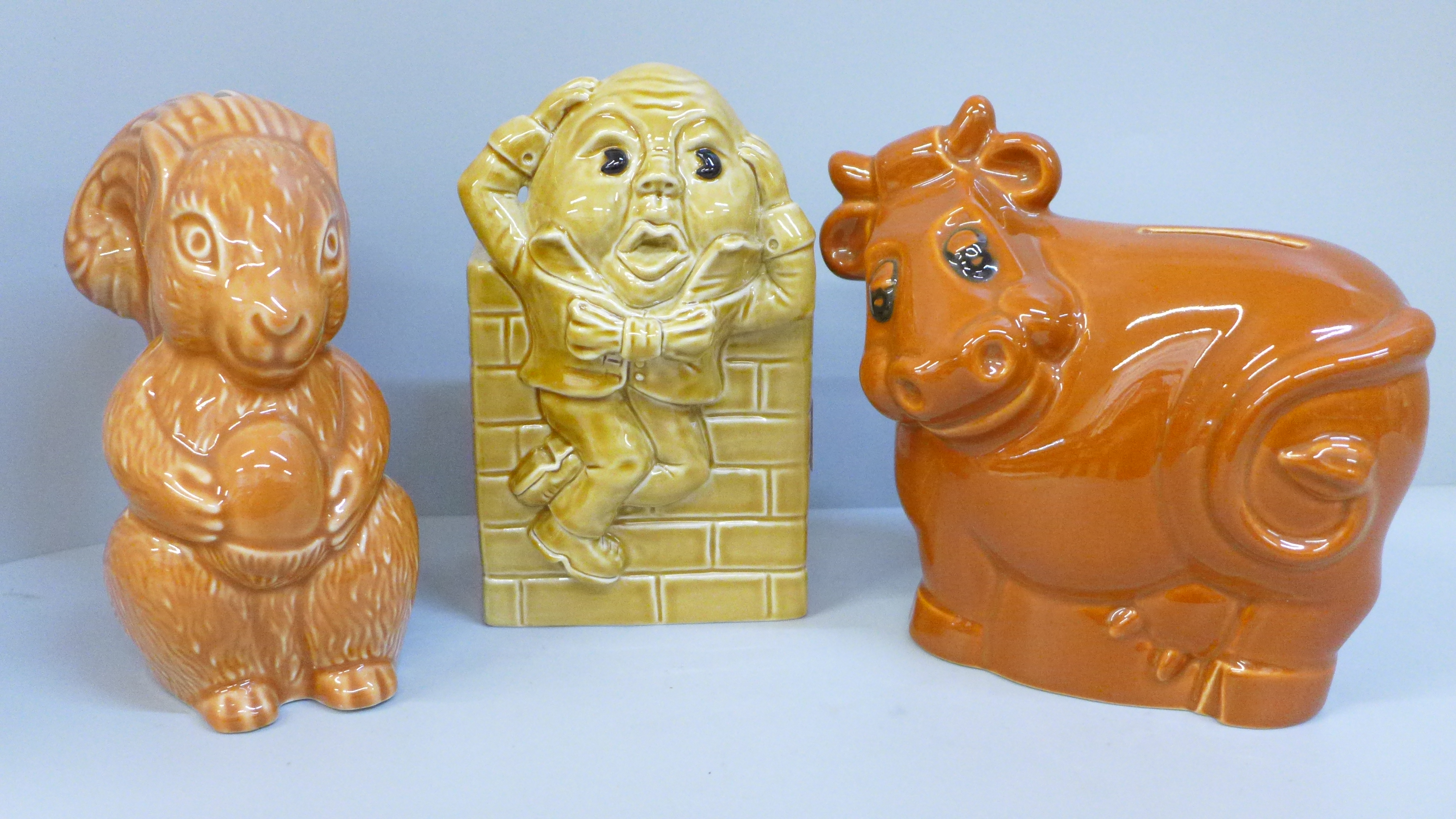 Three Wade money boxes; Humpty Dumpty, cow and squirrel