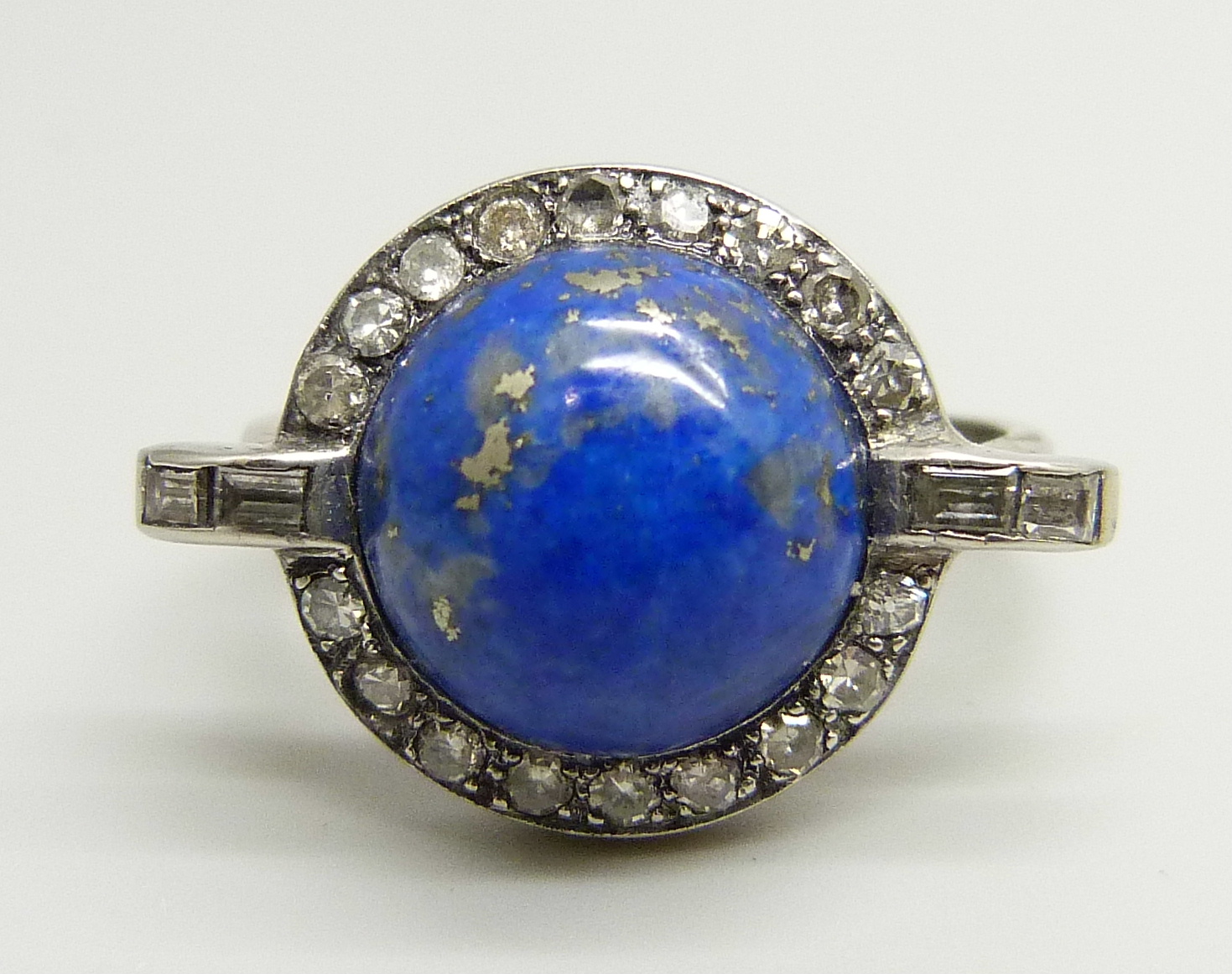 An 18ct white gold Art Deco style lapis lazuli and diamond ring, 7.1g, U