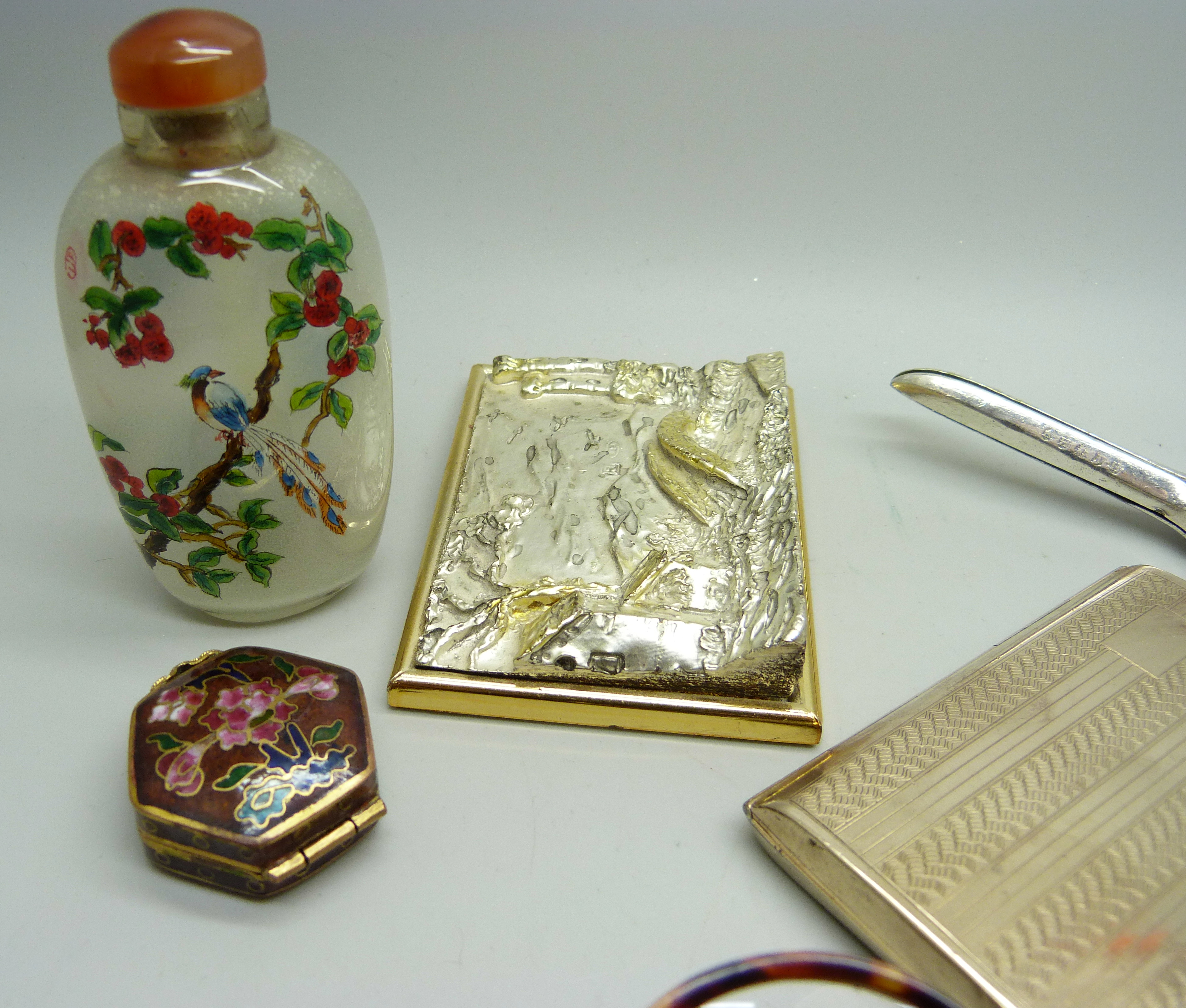 An oriental scent bottle, a seal, an enamelled pill box, a silver covered scene, etc. - Image 2 of 4