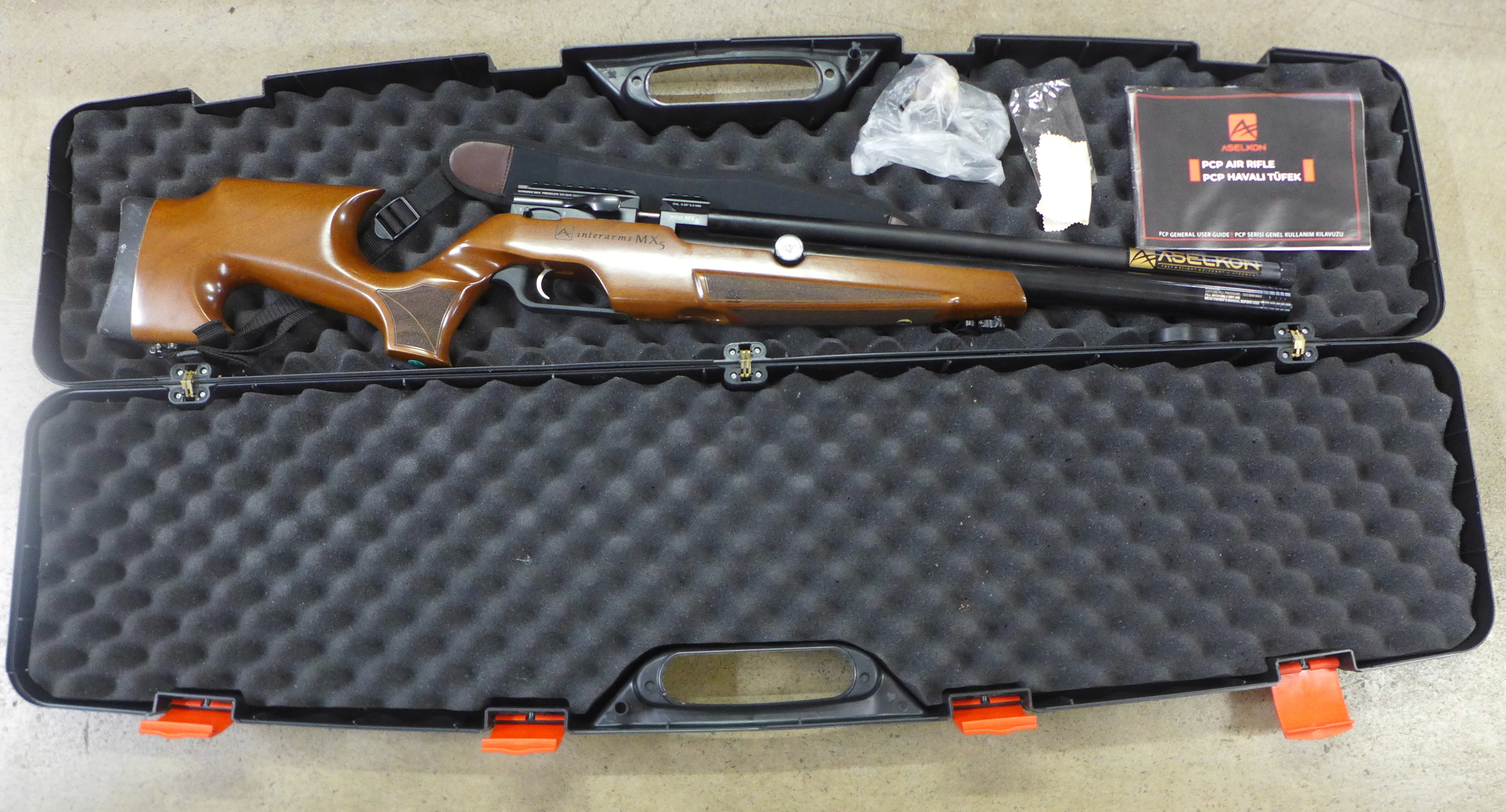 An Aselkon PCP .22 calibre air rifle with two magazines, as new condition, in a hard case