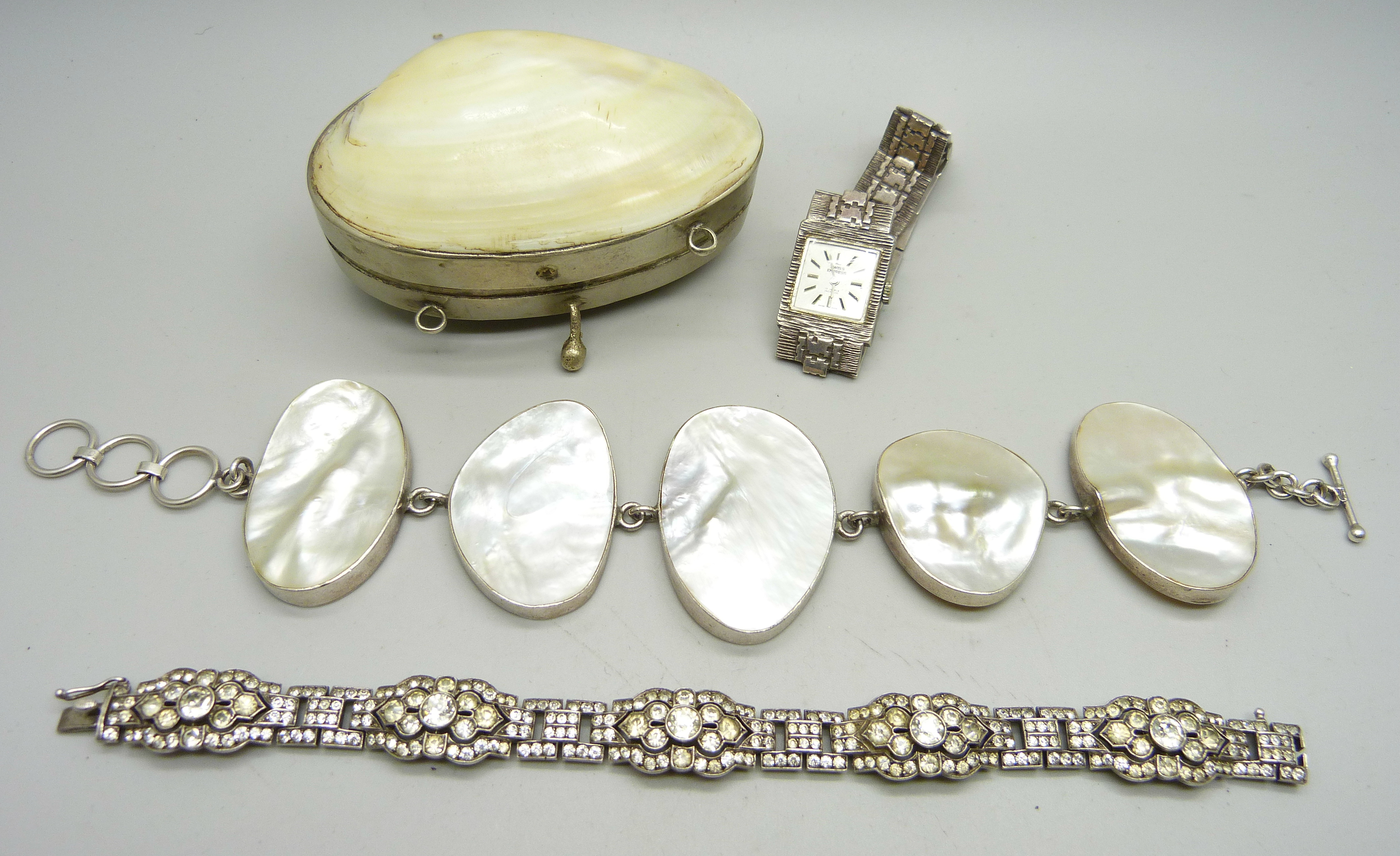 A silver and mother of pearl bracelet, a silver and paste set bracelet, a lady's silver cocktail