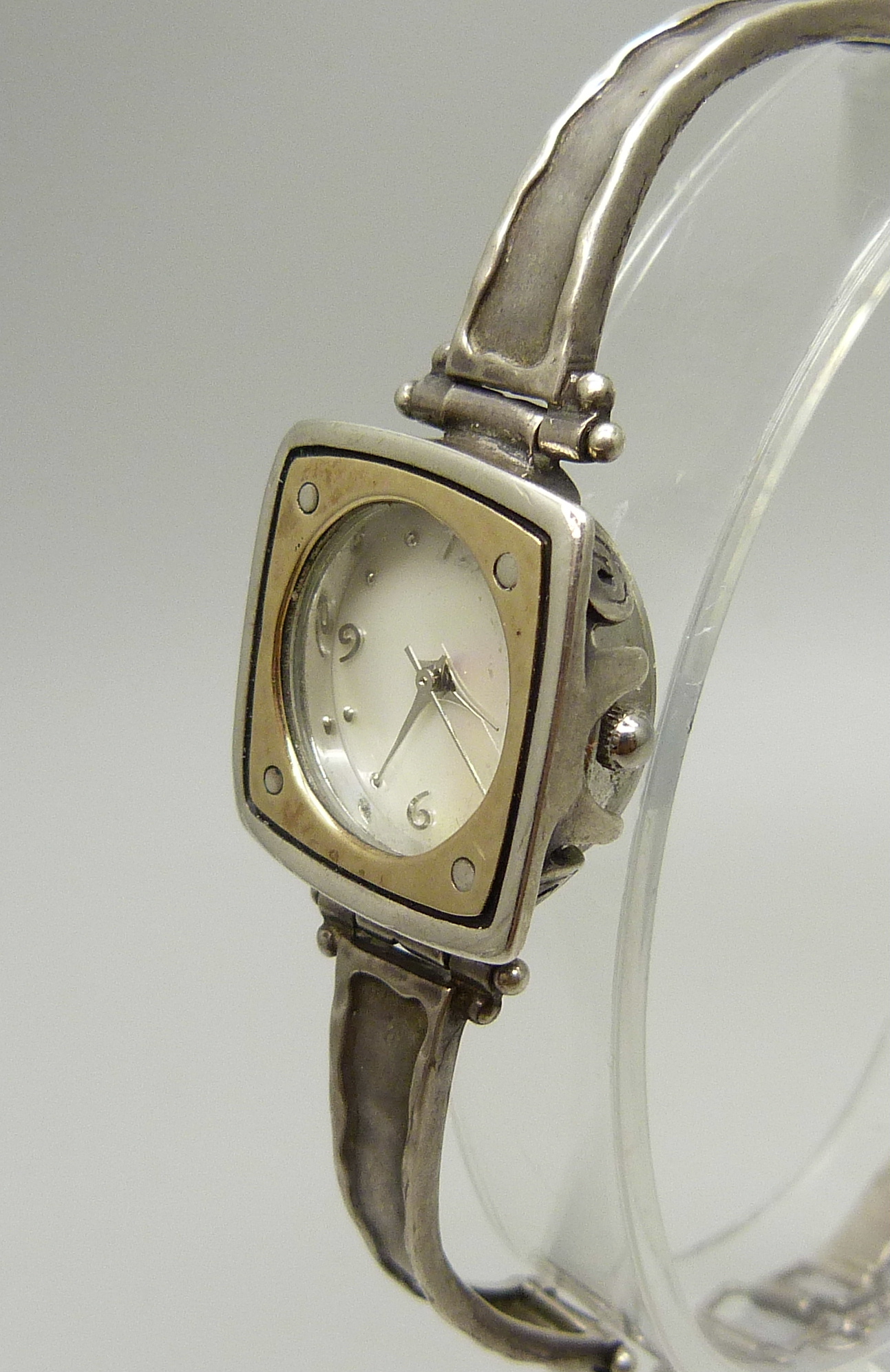 A lady's silver wristwatch with hammered design bezel and strap, hallmarked on the clasp with - Image 2 of 4