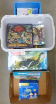 A box of PC gaming magazines and two boxes of dinosaur figures **PLEASE NOTE THIS LOT IS NOT