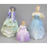 Three Royal Doulton ladies; Top 'o' the Hill, HN1833, Enchantment, HN2178 and Rose, HN2123