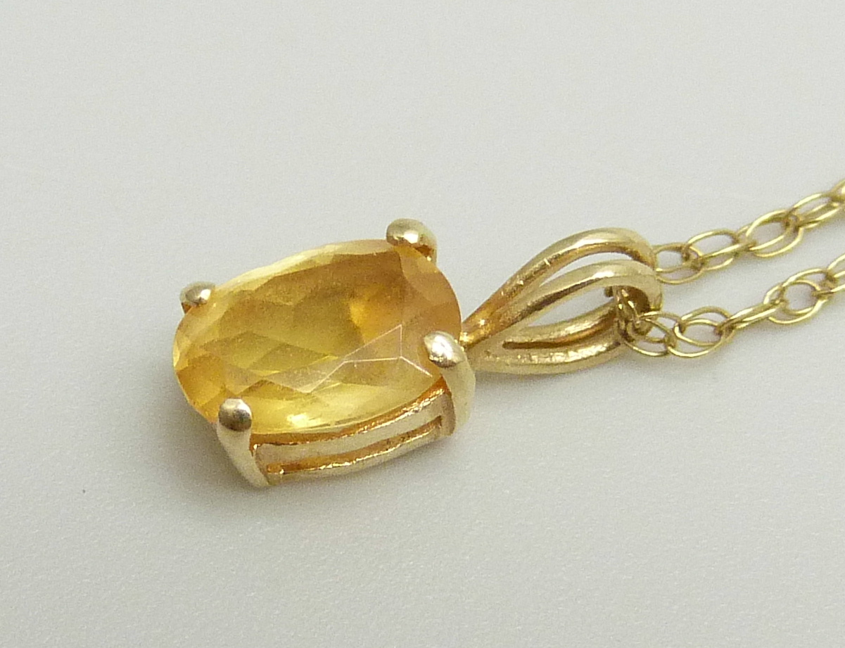 A 14ct gold pendant set with a citrine on a fine 9k gold chain, chain approximately 47cm, pendant - Image 2 of 3