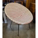 A 1960s faux wicker ball chair