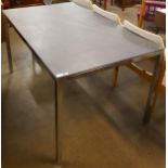 A chrome and slate topped rectangular dining table