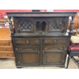 A carved oak court cupboard