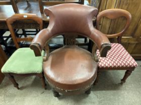 A Victorian oak revolving library chair and two other chairs