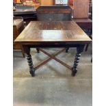 An early 20th Century oak barleytwist draw-leaf table