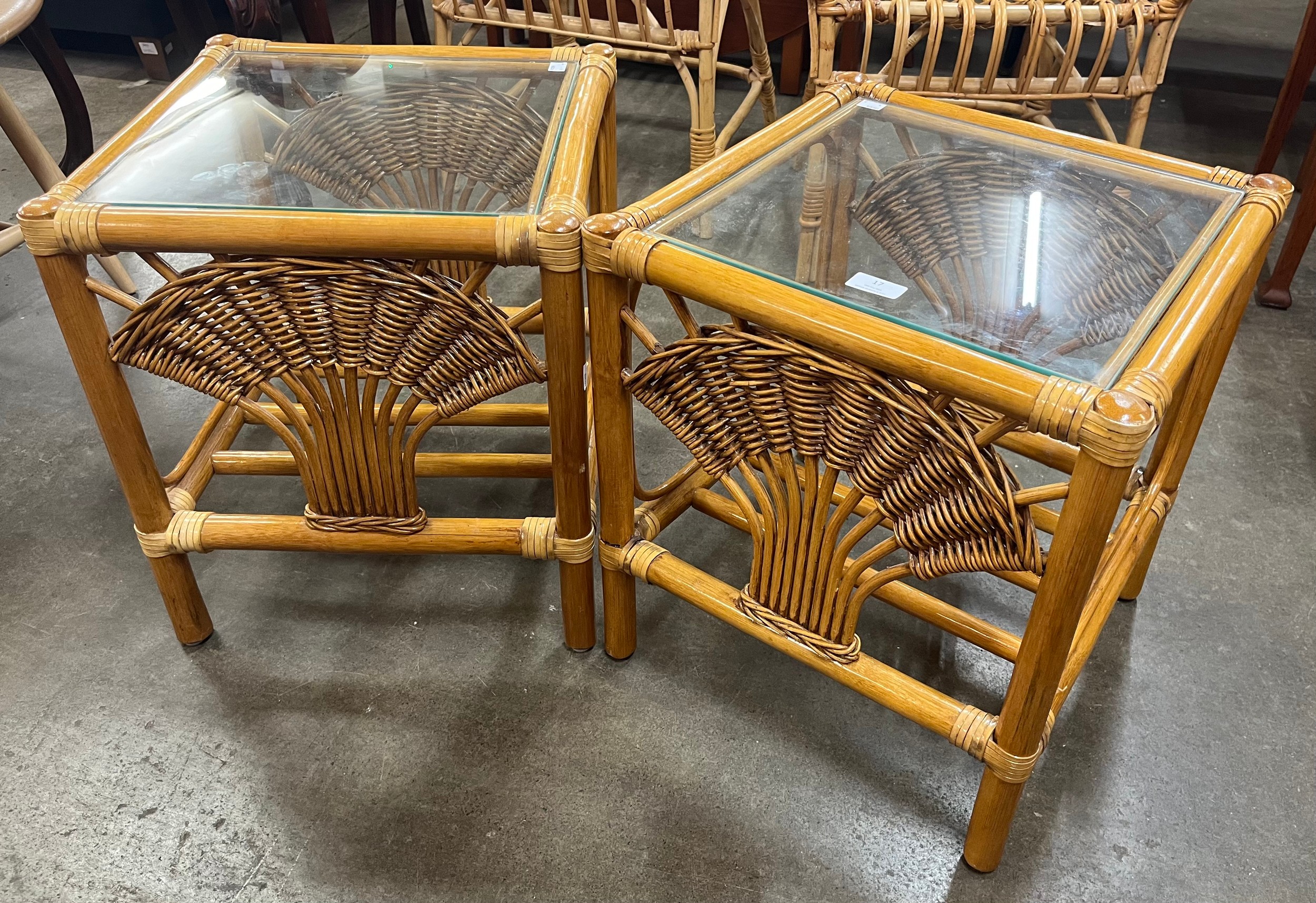 A pair of Italian bamboo and glass topped occassional tables