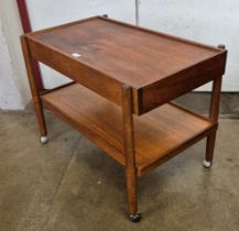A Danish teak two drawer cocktail trolley