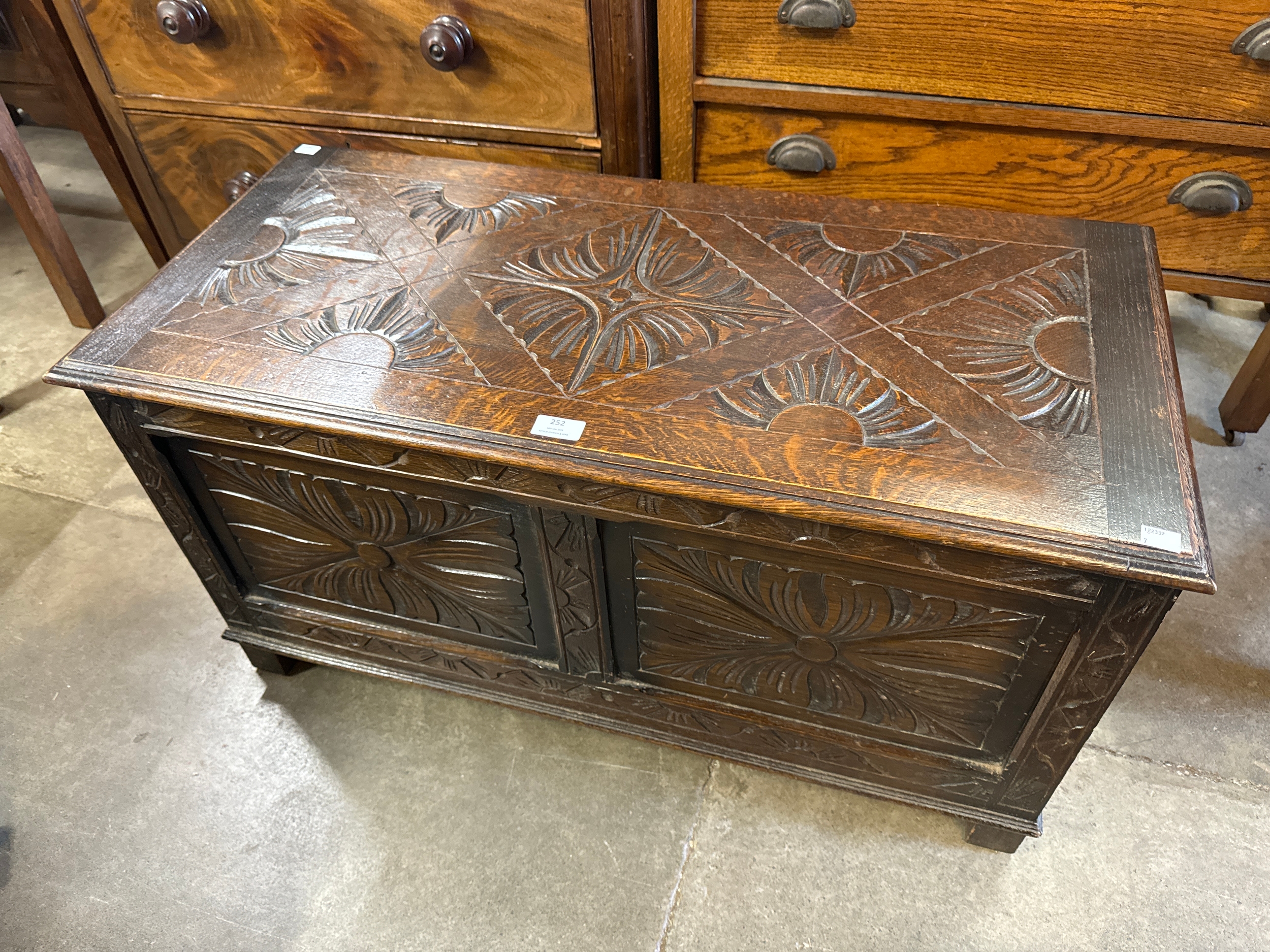 A 17th Century style carved oak blanket box