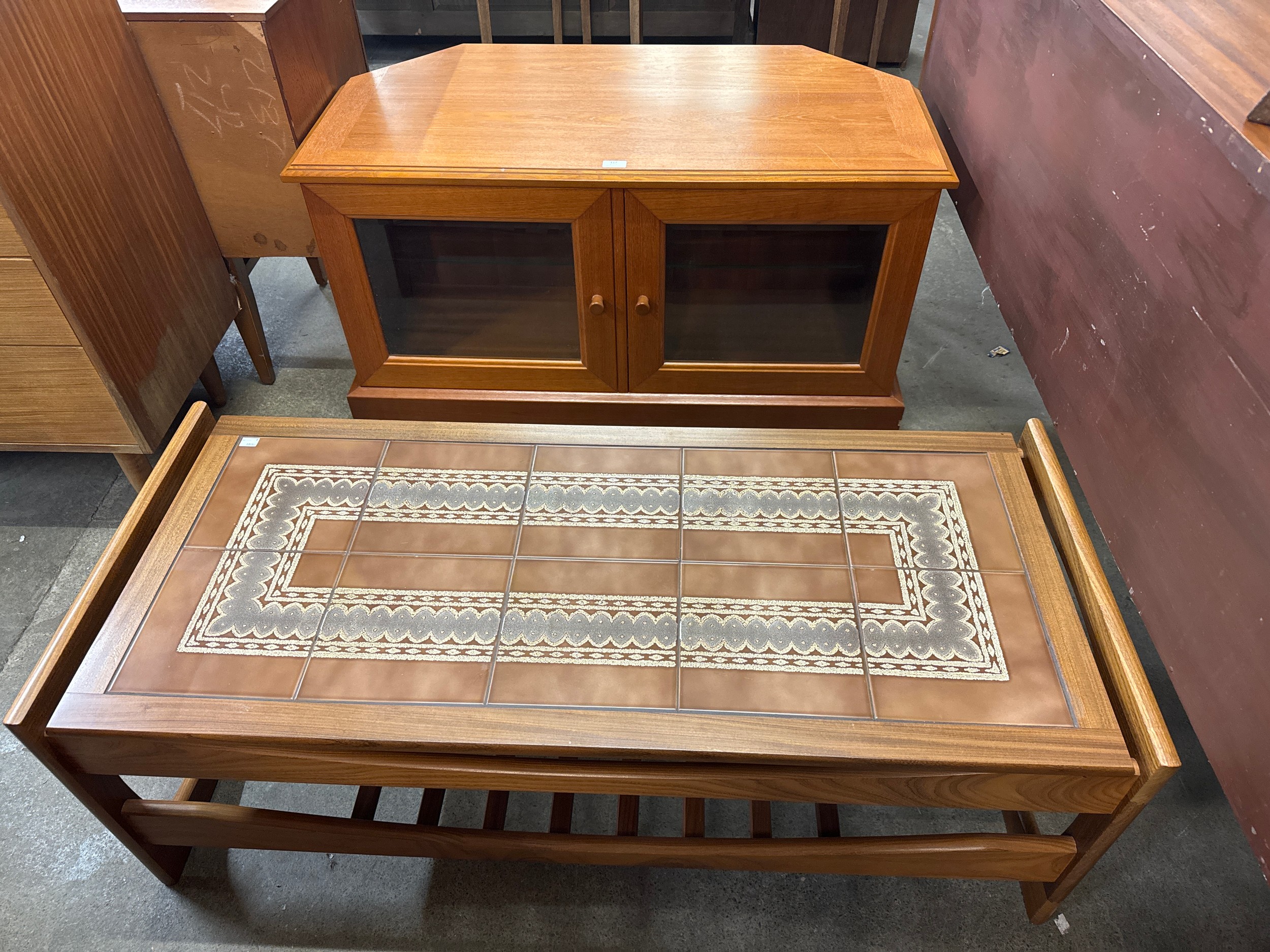 A teak and tiled top coffee table and a teak TV stand