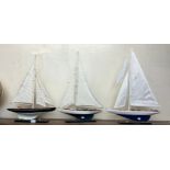 Three model yachts