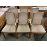 A set of six Nathan teak dining chairs