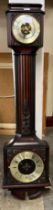 A mahogany aneroid barometer/clock