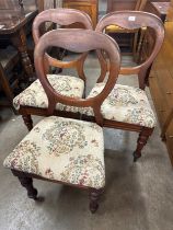 A set of three Victorian mahogany balloon back dining chairs