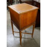 An early 20th Century oak sewing box on stand