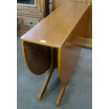 A teak drop-leaf table