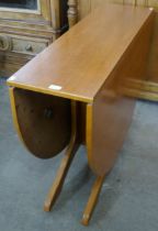 A teak drop-leaf table