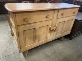 An Ercol Blonde elm and beech sideboard