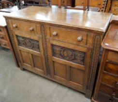 An Elizabethan Revival carved Ipswich oak dresser