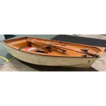 A 10ft Mirror dingy sailing boat with mast, sail, oars, rudder and other accessories.