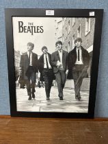 A black and white Beatles print, framed