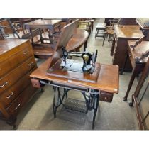 A Jones sewing machine and table