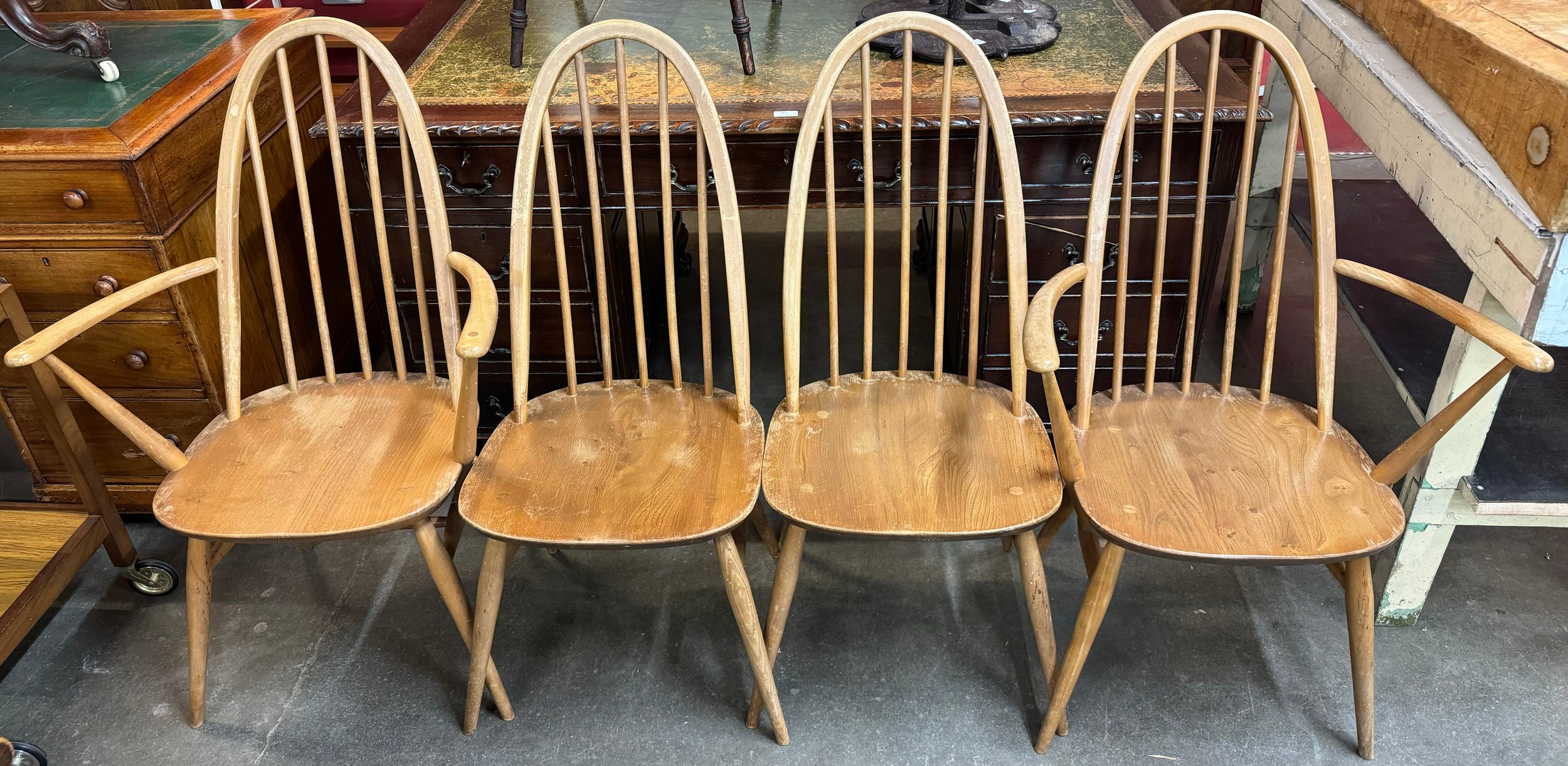 A set of four Ercol blonde elm and beech Quaker dining chairs