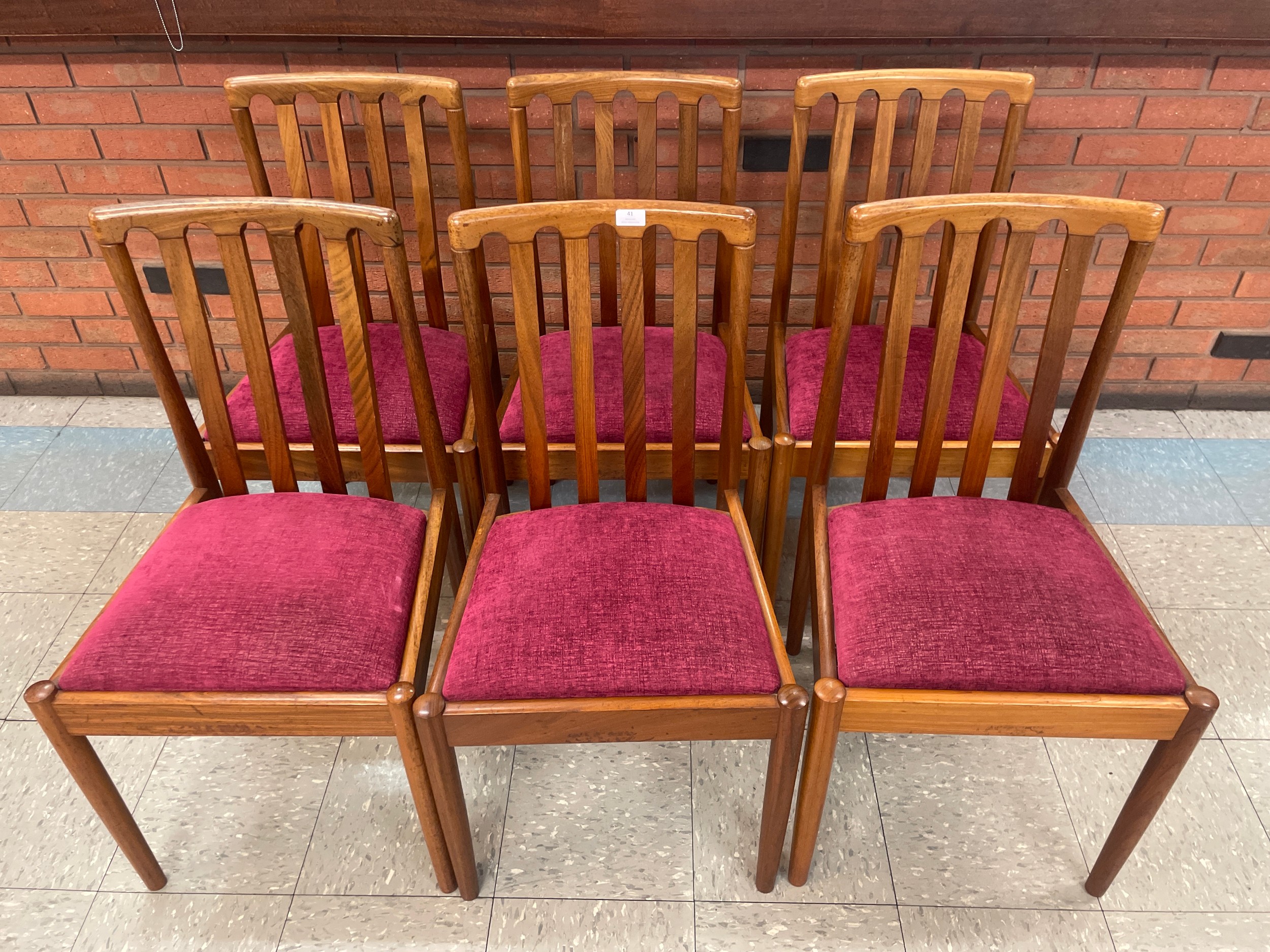 A set of six teak dining chairs