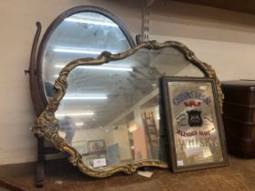 A gilt framed mirror, toilet mirror and Chivas Regal pub mirror