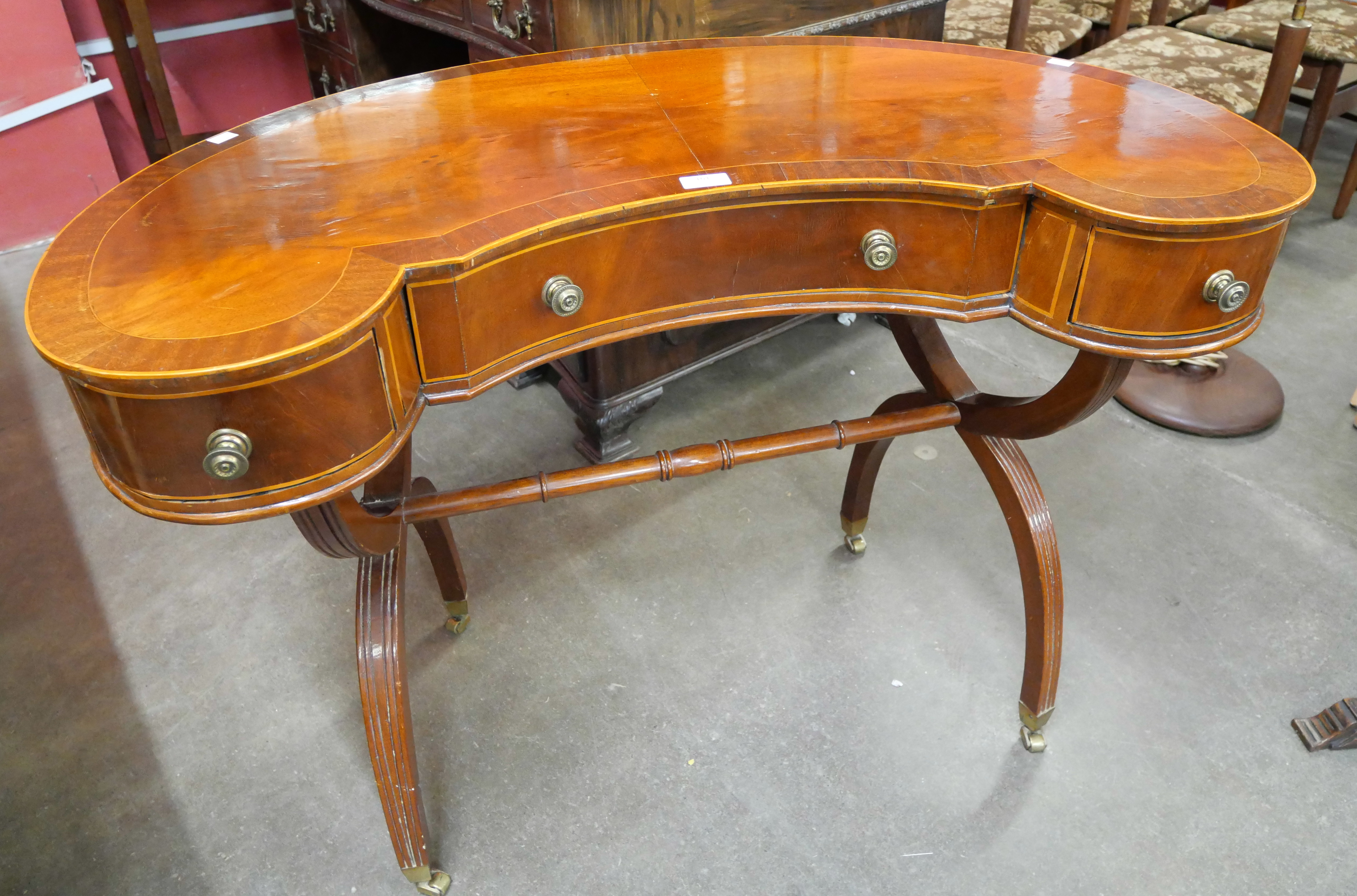 A Regency style inlaid kidney shaped writing table