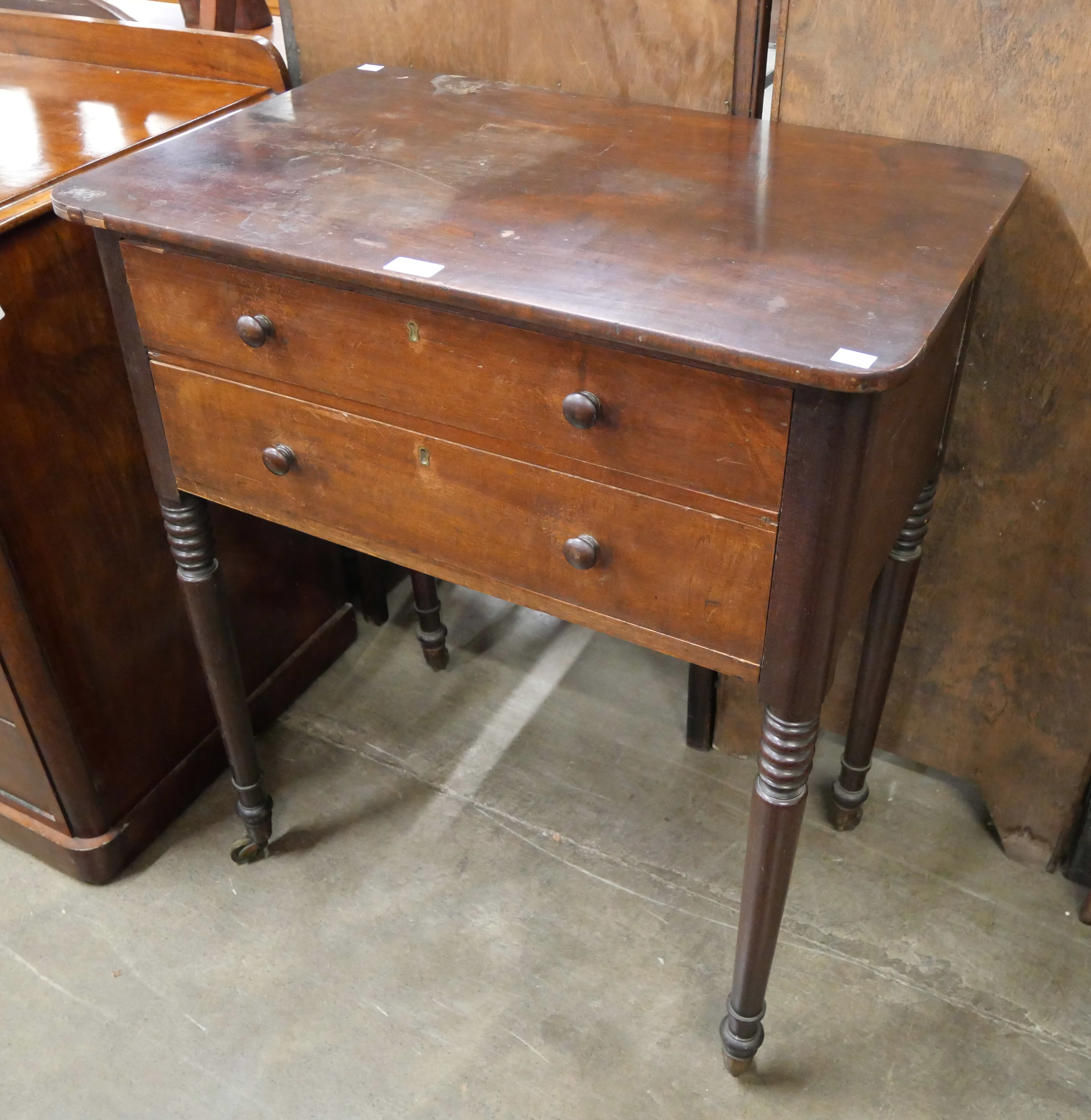 A George IV mahogany two drawer side table