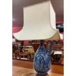 An eastern stoneware vessel shaped table lamp