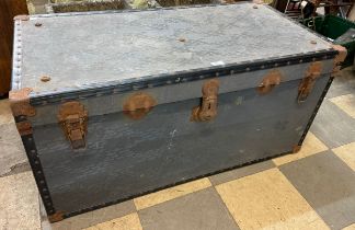 A metal bound steamer trunk
