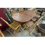 A teak garden table and six chairs