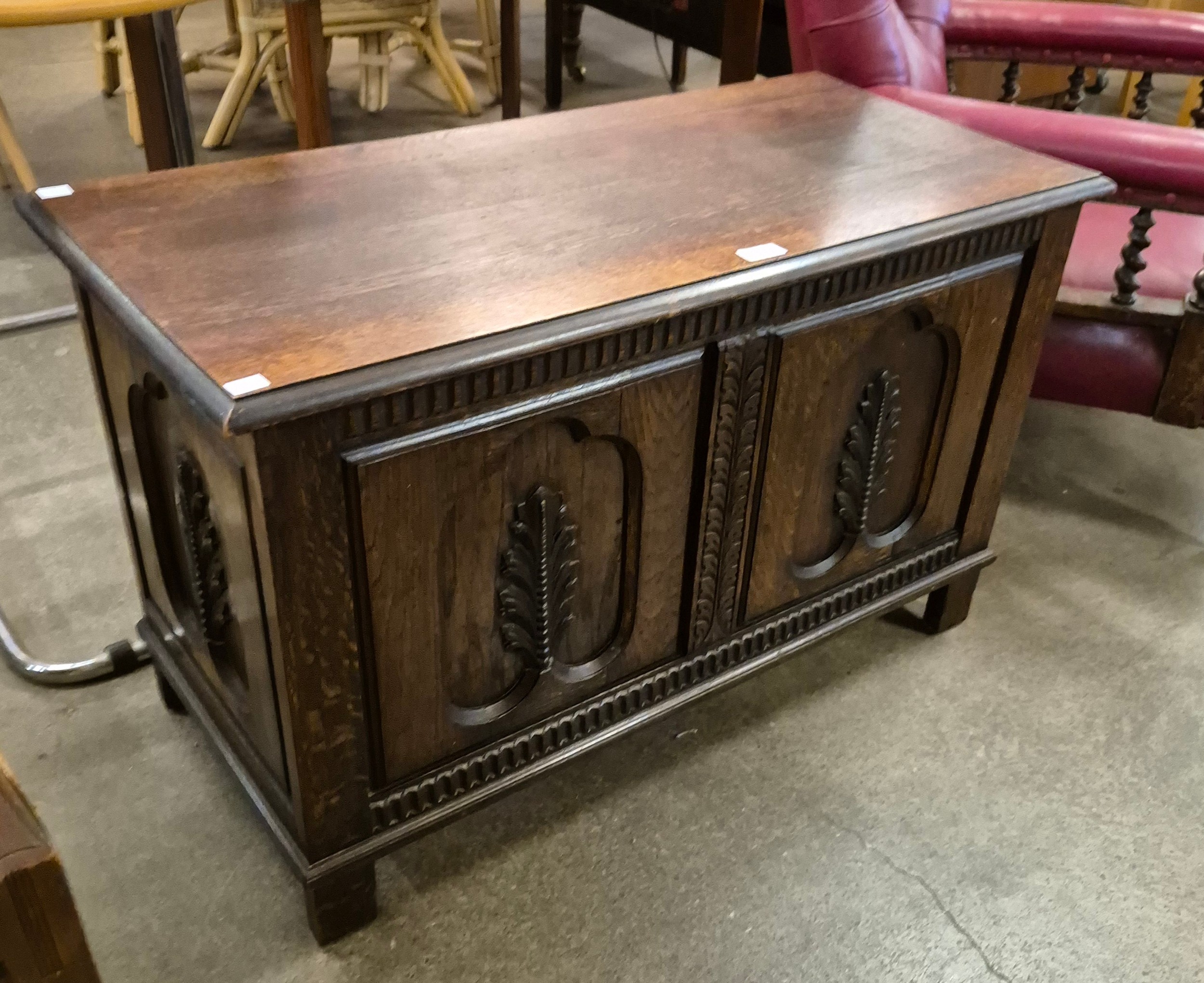 A 17th Century style carved oak blanket box