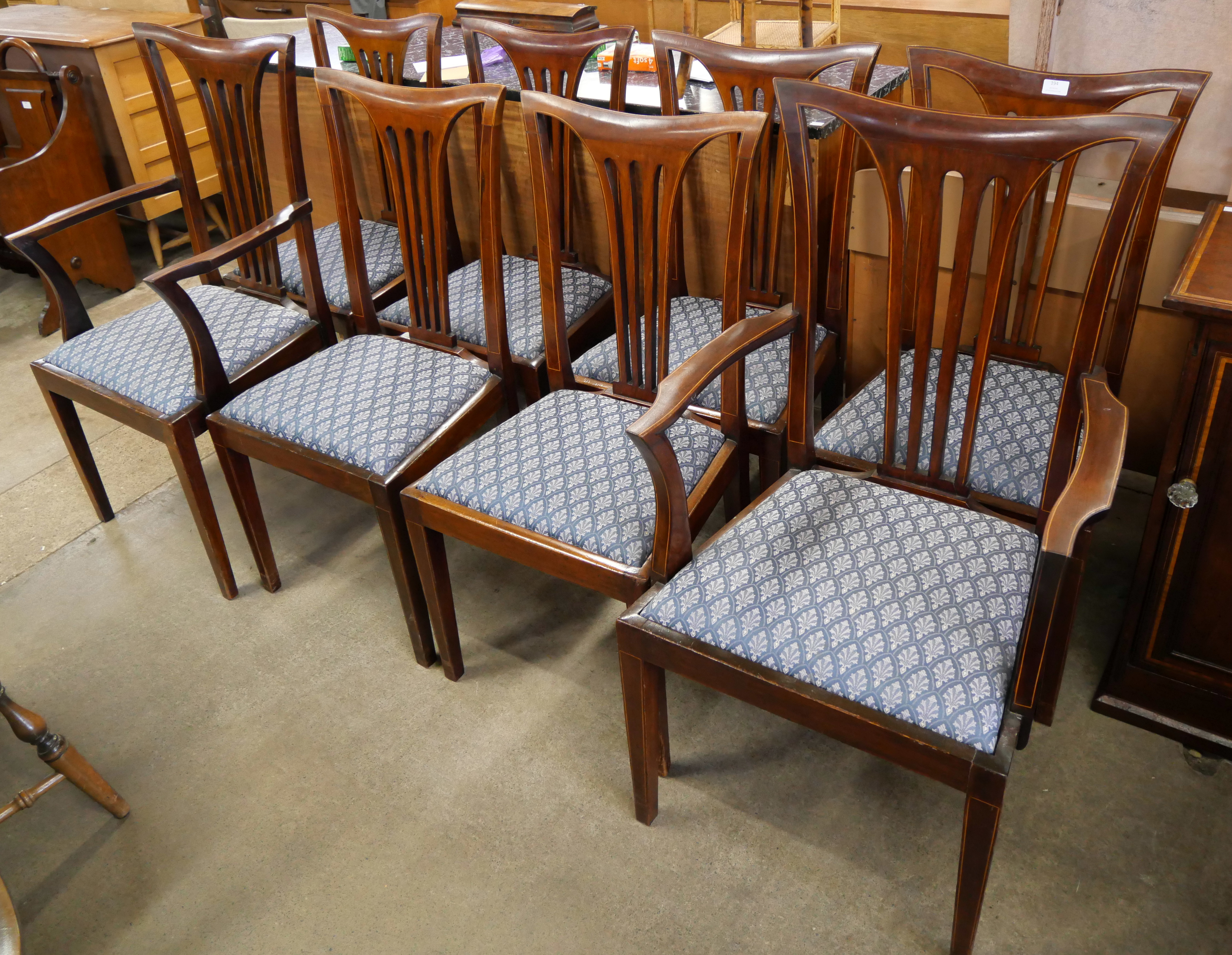 A set of eight Edward VII inlaid mahogany dining chairs