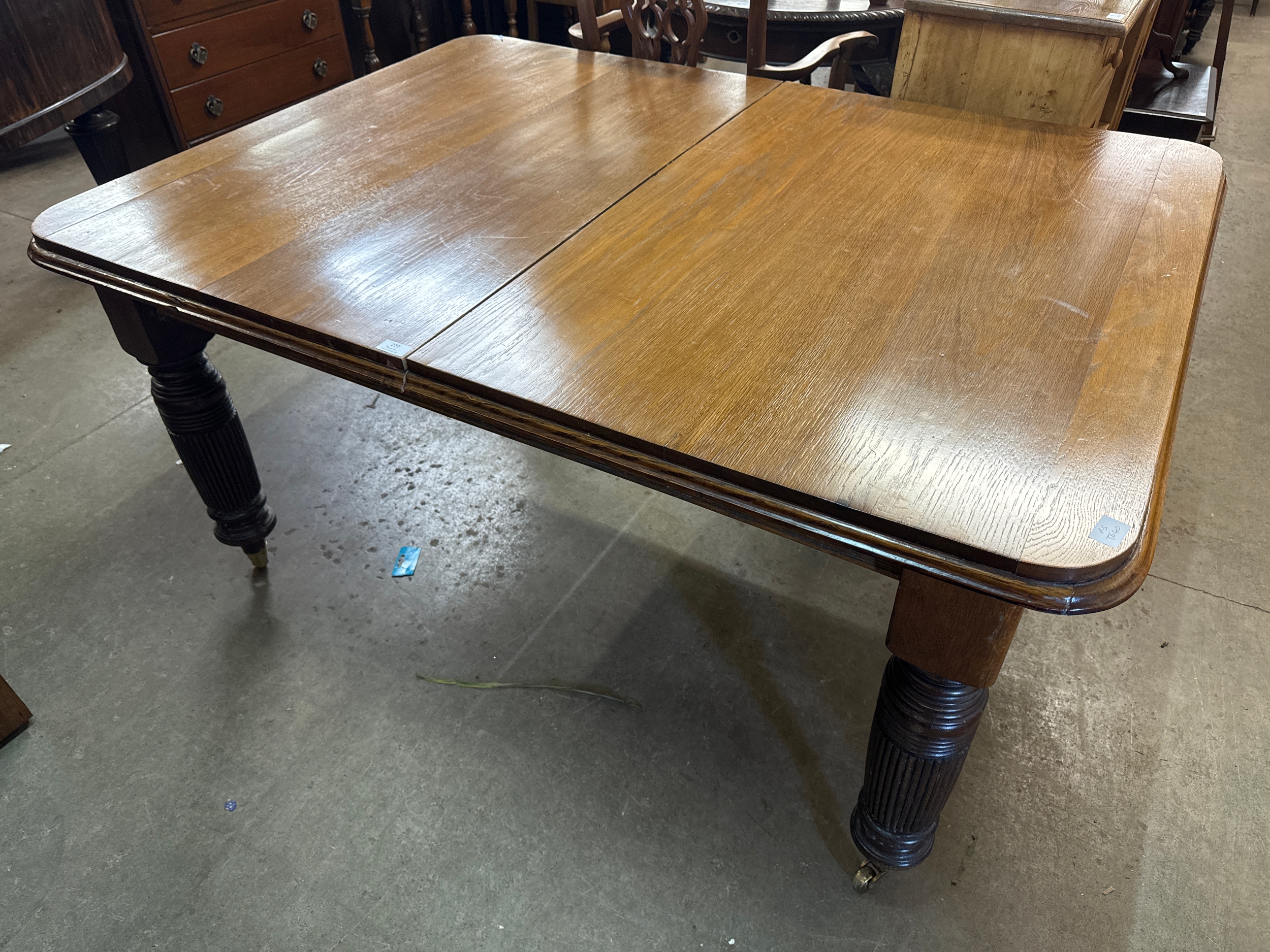 A late Victorian mahogany extending dining table