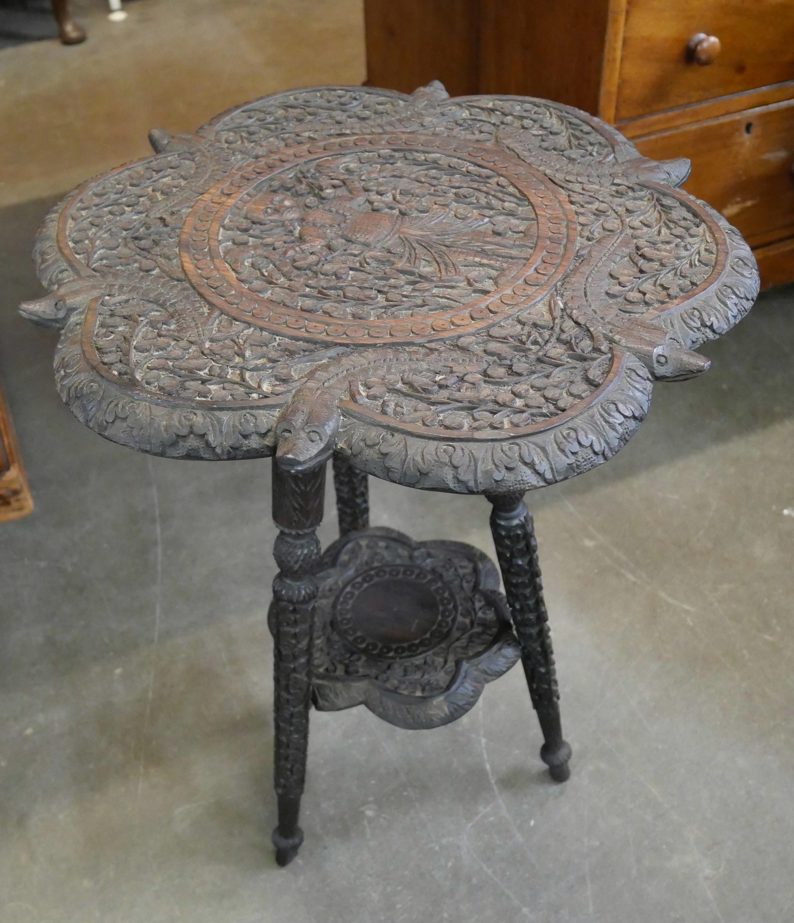 A Burmese carved hardwood occasional table