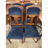 A set of four Art Nouveau style dining chairs