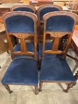 A set of four Art Nouveau style dining chairs