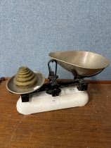 A set of Avery weighing scales and graduated brass weights