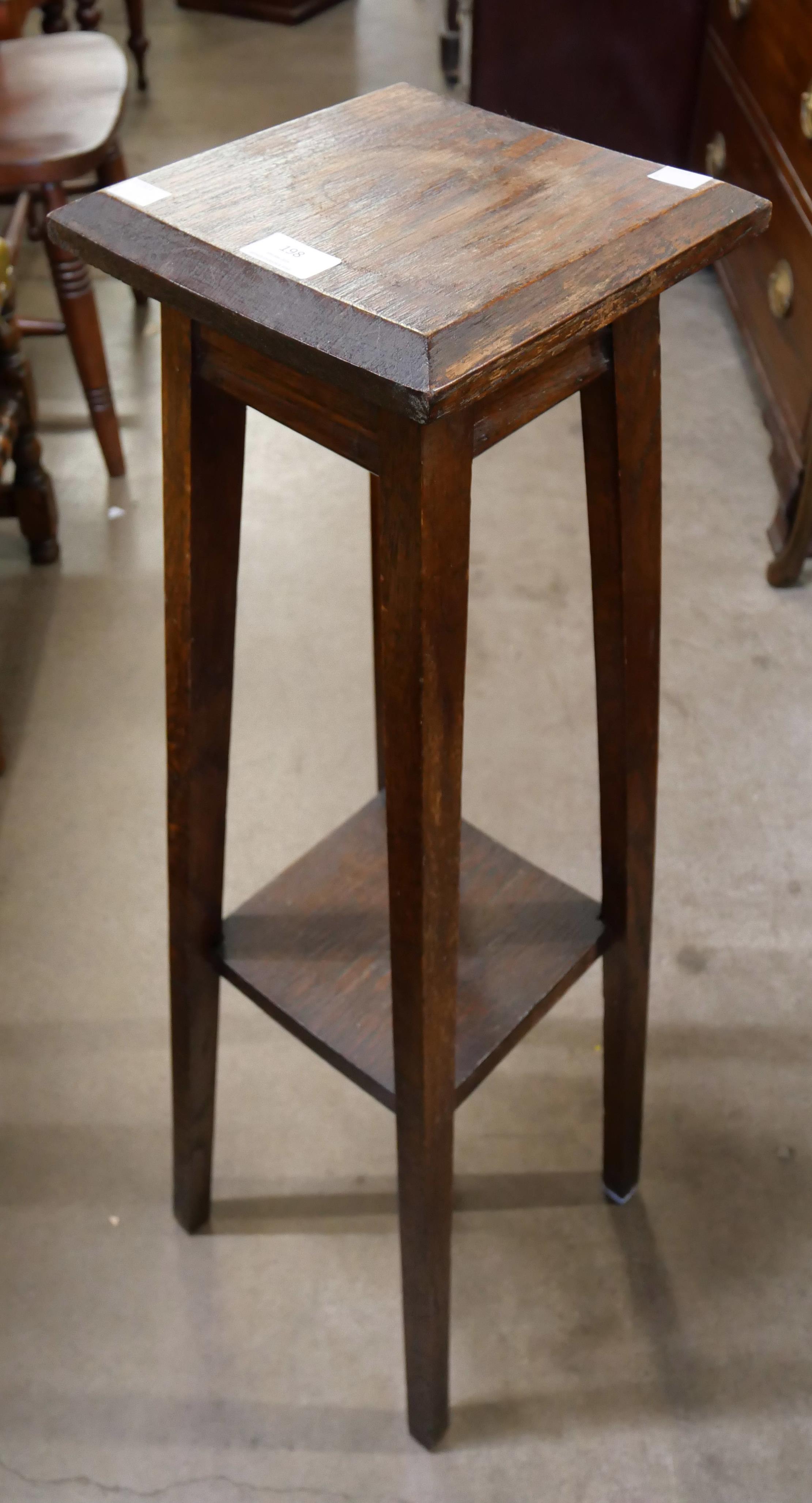 An early 20th Century oak jardiniere stand