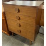 A teak chest of drawers