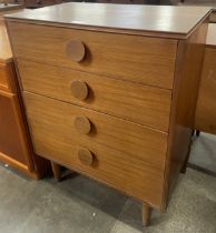 A teak chest of drawers